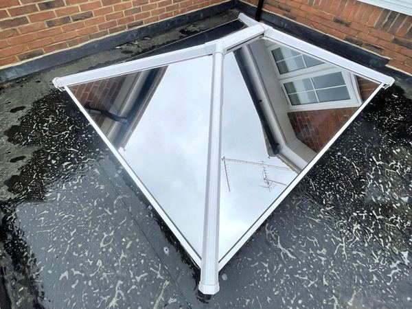Solar film on a small white-framed roof lantern
